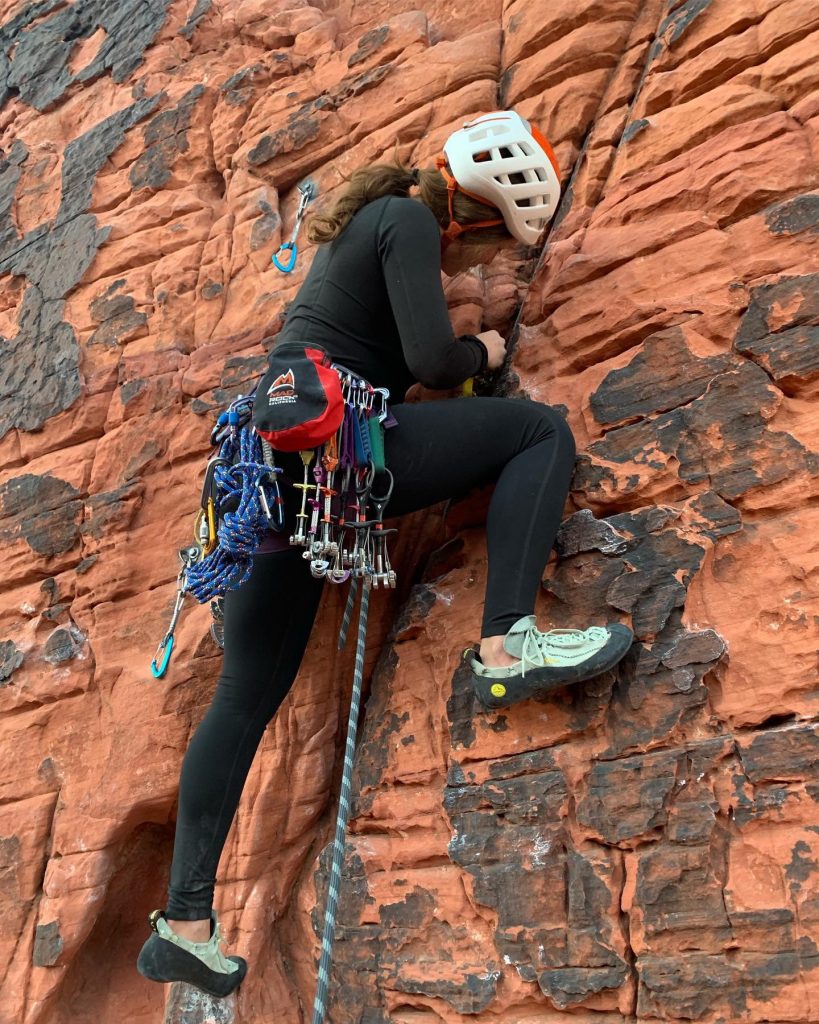 woman trad rock climbing