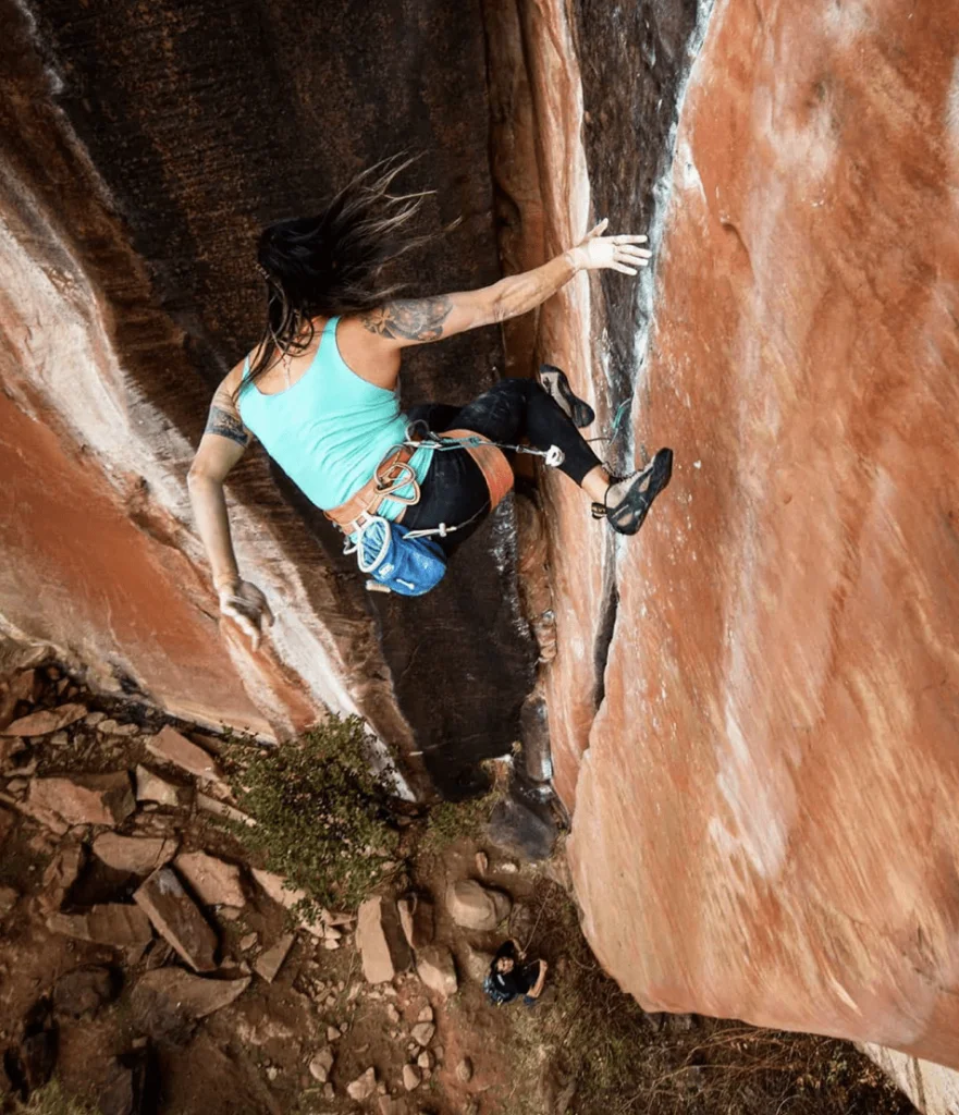 things climbers can do at home | woman taking a fall while lead climbing 