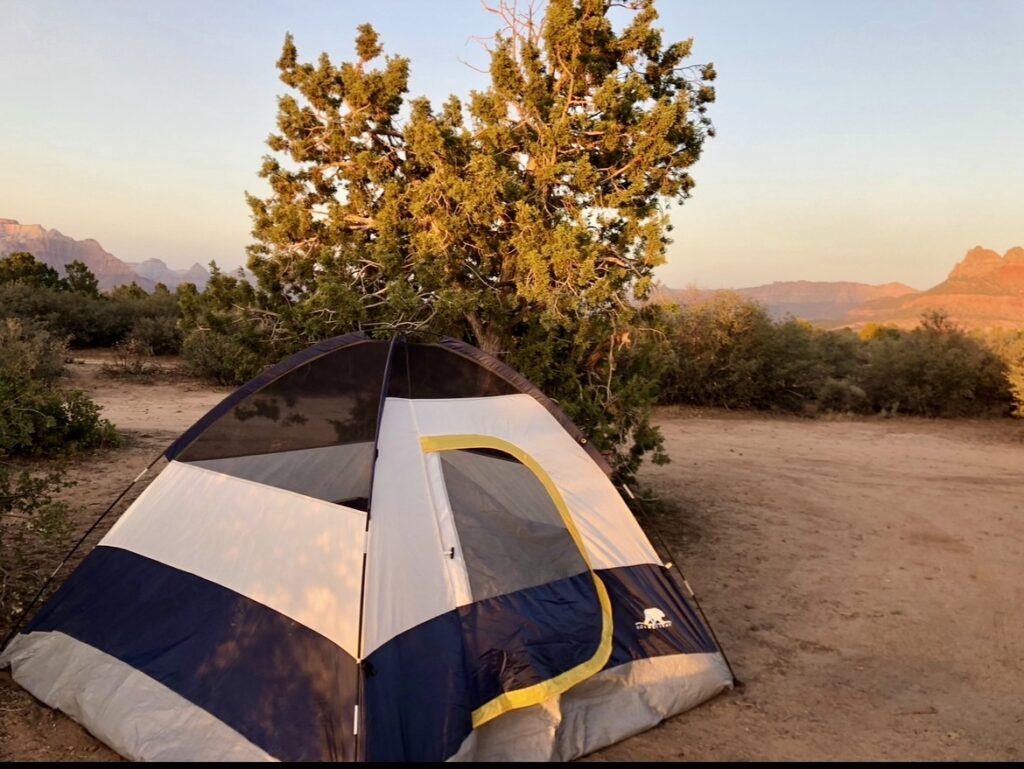 A tent is set up in the desert.